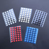Four packs of universal mouse skates in various colors including white, gray, and red on a dark surface.