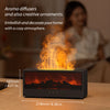 A black aroma diffuser emitting warm orange light and smoke, used for home decoration.