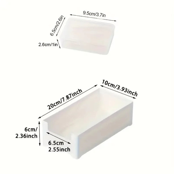 A white cable organizer storage box with dimensions 9.5cm/3.7in by 6.5cm/2.6in.