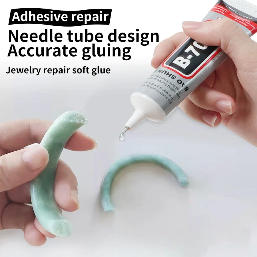 A hand applies a clear, tube-shaped adhesive glue to a curved piece of jewelry.
