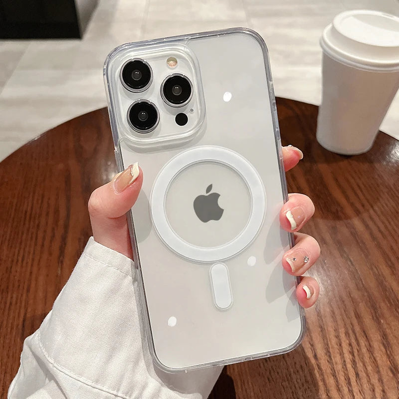 A hand holds a clear magnetic transparent phone case with an Apple logo and multiple camera lenses on the back.
