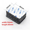 A stack of heavy duty double-sided foam mounting tape sheets showing dimensions 54mm by 85mm