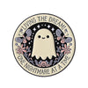A round enamel pin featuring a white ghost with wings and text that reads Living the Dream One Nightmare at a Time