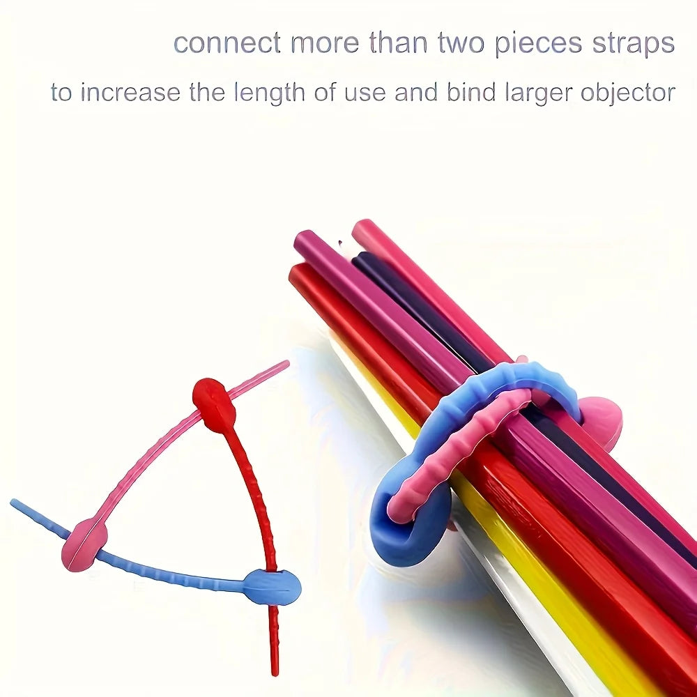 Silicone cable organizer with multiple colored straps used to connect and bind objects.