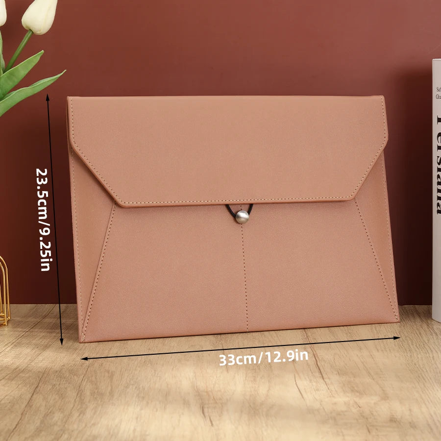A light pink leather document organizer bag with a flap and silver clasp, shown against a brown background.