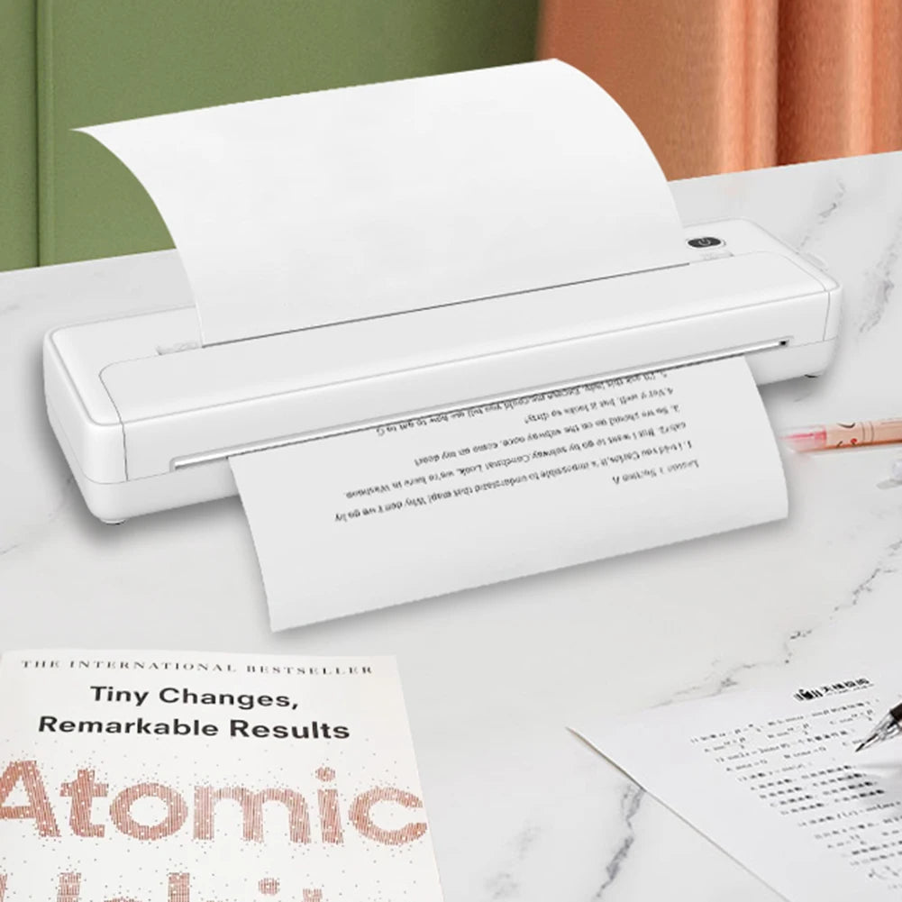 A white thermal paper printer is shown next to a sheet of printed paper on a marble surface.