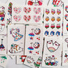 Colección de pegatinas temporales de múltiples diseños con corazones, animales y patrones coloridos.