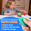A child is holding a green fidget toy while an adult's hand holds another green silicone fidget tool.