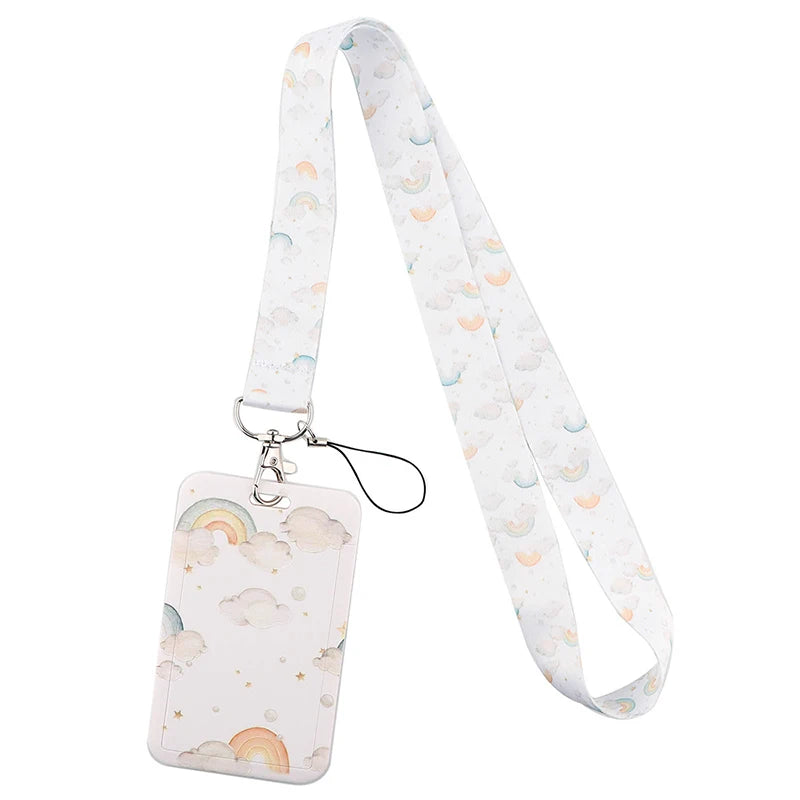 A white lanyard with a pastel rainbow cloud pattern attached to an ID badge holder.