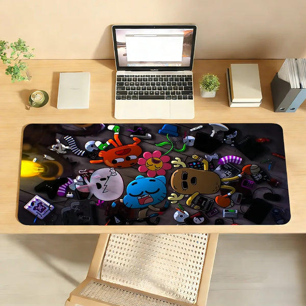A black mouse pad featuring various cartoon characters and gaming accessories placed on a wooden desk.