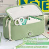 A light green magnetic buckle front bag pencil case with a transparent flip pocket.