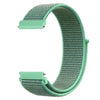 A close-up view of a mint green nylon loop watch strap for kids.
