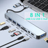 A silver 8-in-1 USB hub featuring USB A and USB C ports, SD/TF card slots, and a 3.5mm audio jack.