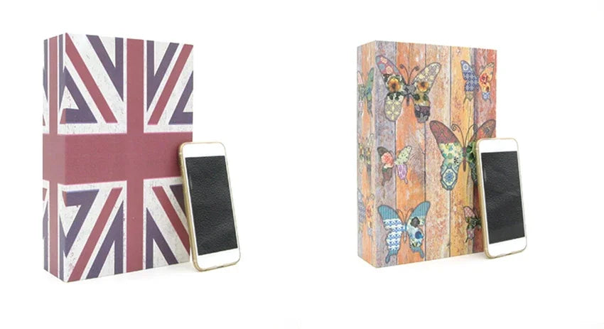 A rectangular box featuring a Union Jack pattern and a wooden background with colorful butterflies, next to two smartphones.