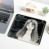 A black and white illustration of Junji Ito's Tomie featuring long hair on a mouse pad.