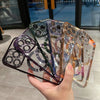 A hand holds a stack of magnetic clear phone cases with various colored and plated finishes.