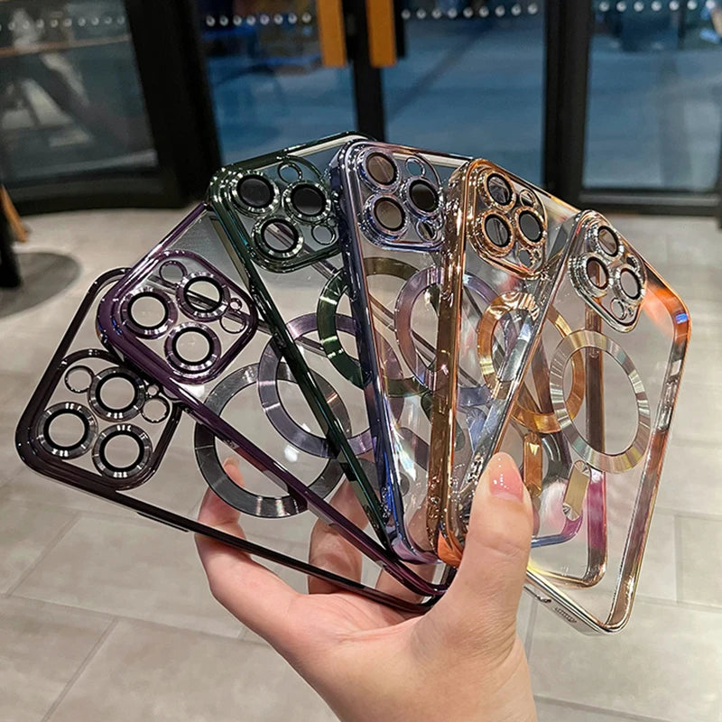 A hand holds a stack of magnetic clear phone cases with various colored and plated finishes.
