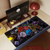 A dark mouse pad featuring various cartoon characters and playful designs on a wooden desk.