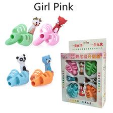 A set of pink and green silicone pencil grips shaped like animals for children's handwriting aid.