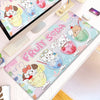 A colorful cartoon gaming desk mat featuring cute characters and fruit-themed designs.