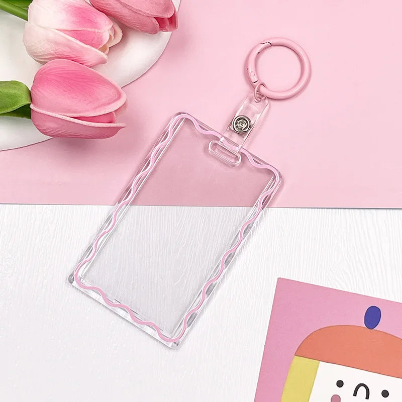 Clear acrylic card holder with a pink border attached to a keychain ring