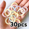 A hand holds 30 pieces of colorful reusable plastic binding rings in various translucent colors.