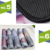 A set of six rolled gaming mouse pads with money print designs shown next to a black textured pad.