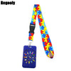 Buntiges Puzzle-Teil-Muster-Lanyard mit schwarzem Clip und blauem Schlüsselring.