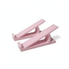 A pink ergonomic keyboard height adjuster stand with a lever mechanism.