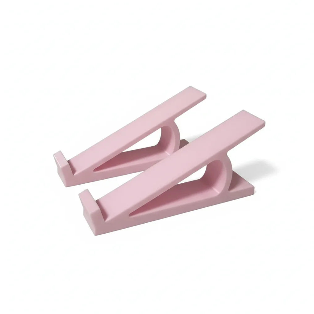 A pink ergonomic keyboard height adjuster stand with a lever mechanism.