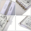 A set of goal-oriented savings binders featuring April and other months, with clear plastic covers and metal rings.