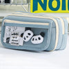 A light blue pencil case with a transparent flip pocket featuring a white panda charm.