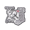 A black enamel lapel pin featuring two figures and text that reads You have enough BOOKS But I don't have these BOOKS