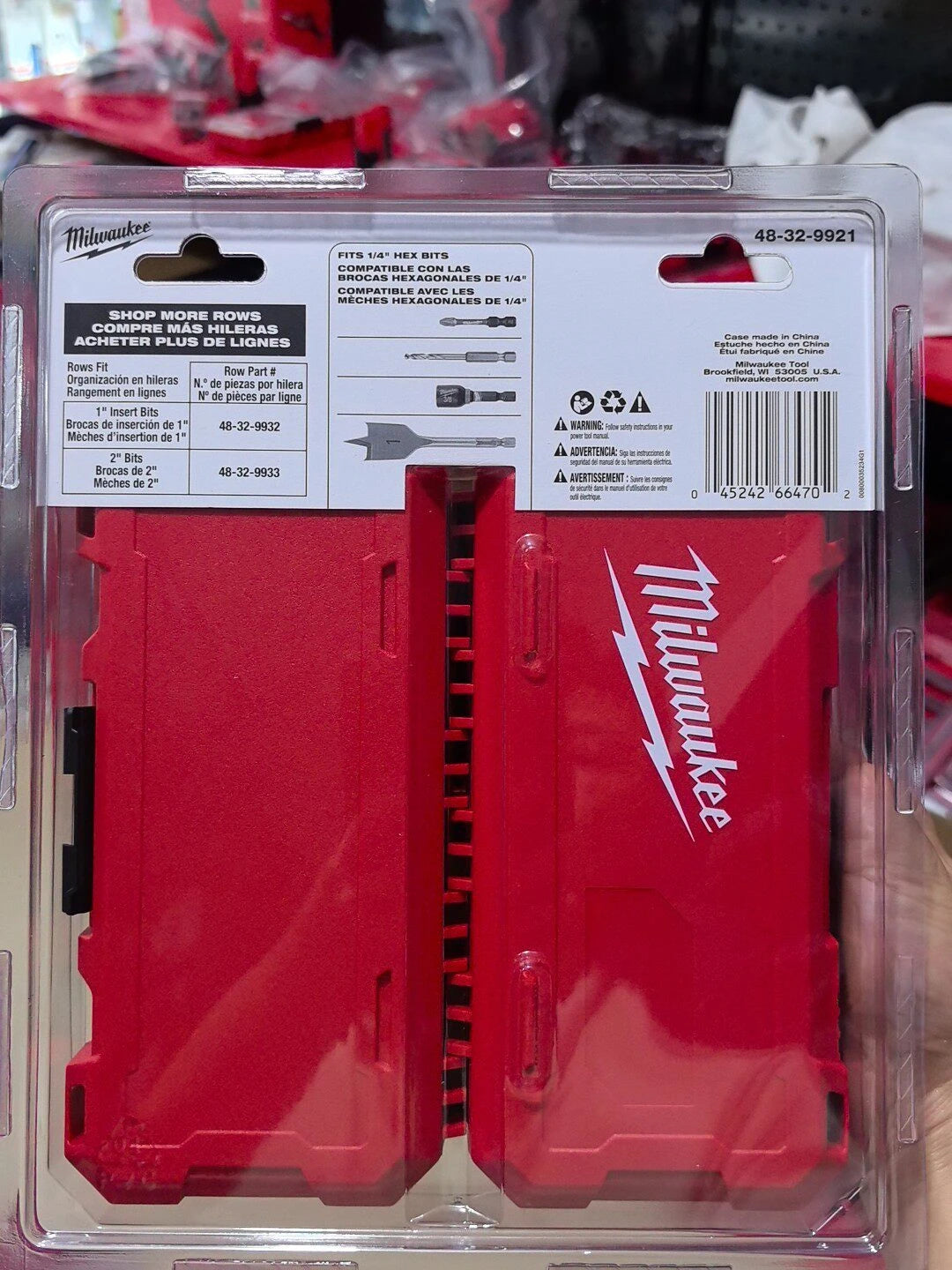 Red Milwaukee bit storage case with multiple slots for various bits and accessories