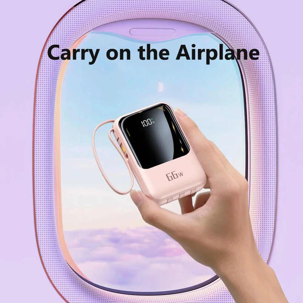 A hand holds a pink power bank with a flashlight, labeled 100%, in an airplane context.