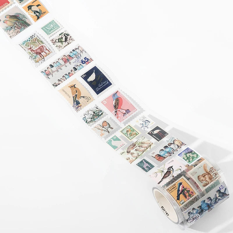 A strip of vintage stamp tape stickers featuring various animal and nature themes for scrapbooking