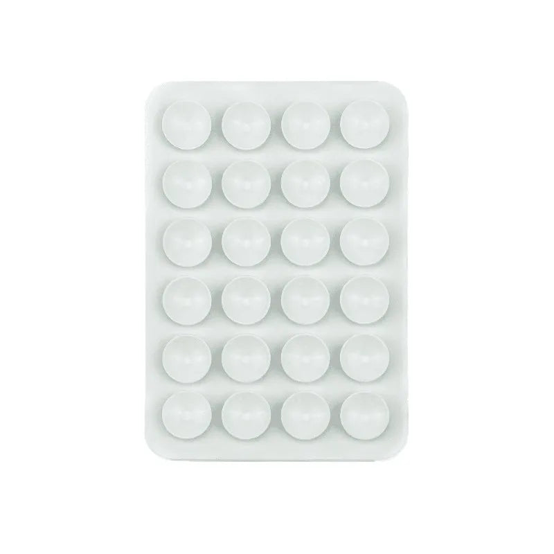 A white plastic tray containing twenty-four silicone suction cups for mounting phones and tablets.
