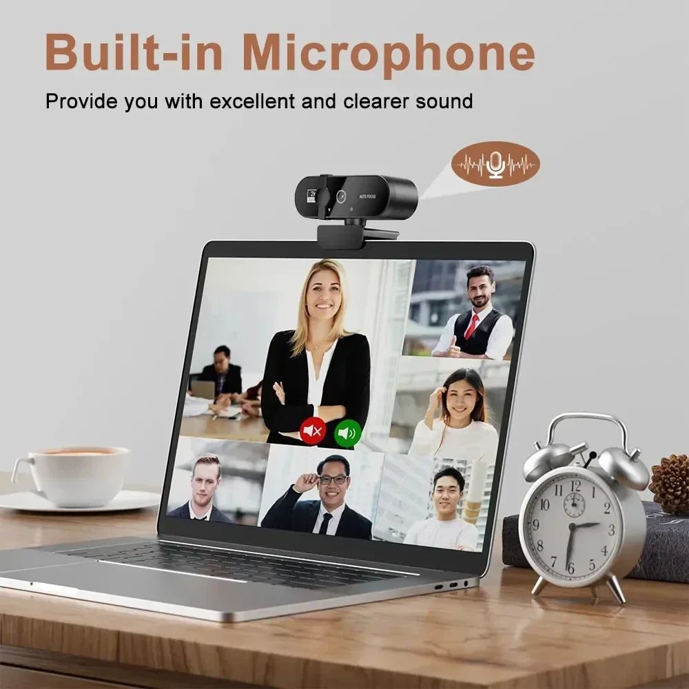 A laptop displaying a video conference call with multiple participants, featuring a built-in microphone webcam.