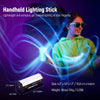 A woman holds a handheld lighting stick emitting blue light against a purple background.