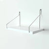 A white wall-mounted projector stand with metal arms for mounting, designed for no drilling required installation.