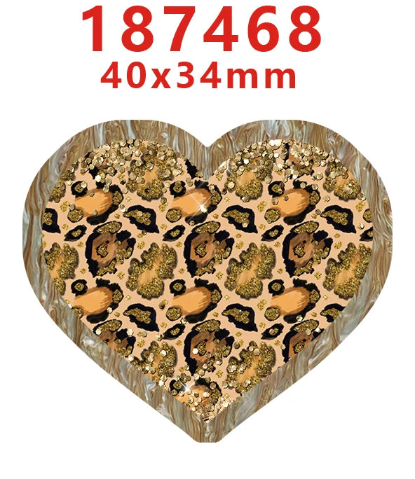 A heart-shaped acrylic hairbow featuring a leopard print design with gold glitter accents.