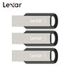 Three silver Lexar flash drives of different capacities 32GB, 64GB, and 128GB shown side by side.