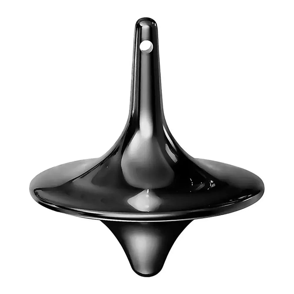 A black metal hand spinning top fidget toy with a small hole at the top.