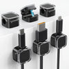 A set of black magnetic cable management clips for organizing wires on desks and walls.