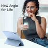 A woman holds a white cup while looking at a tablet, demonstrating a new angle for life.
