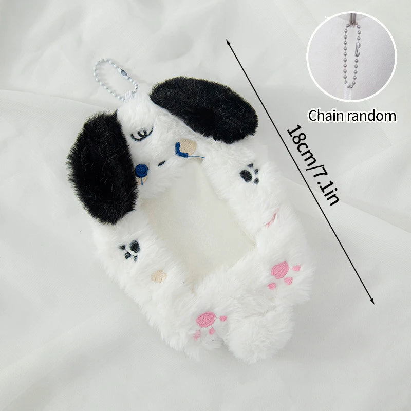 White plush animal holder with black ears and pink accents, shown with a chain for display.