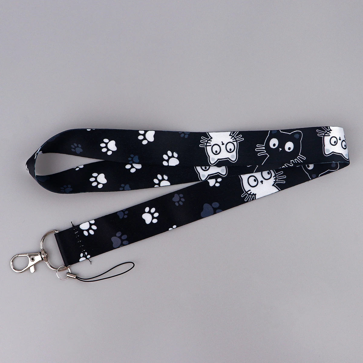 Black patterned cartoon cat card holder lanyard with a neck strap