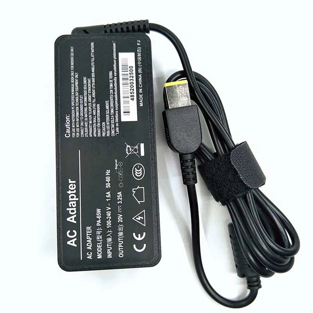 Black AC adapter cable for a laptop, featuring input/output specifications and safety warnings.