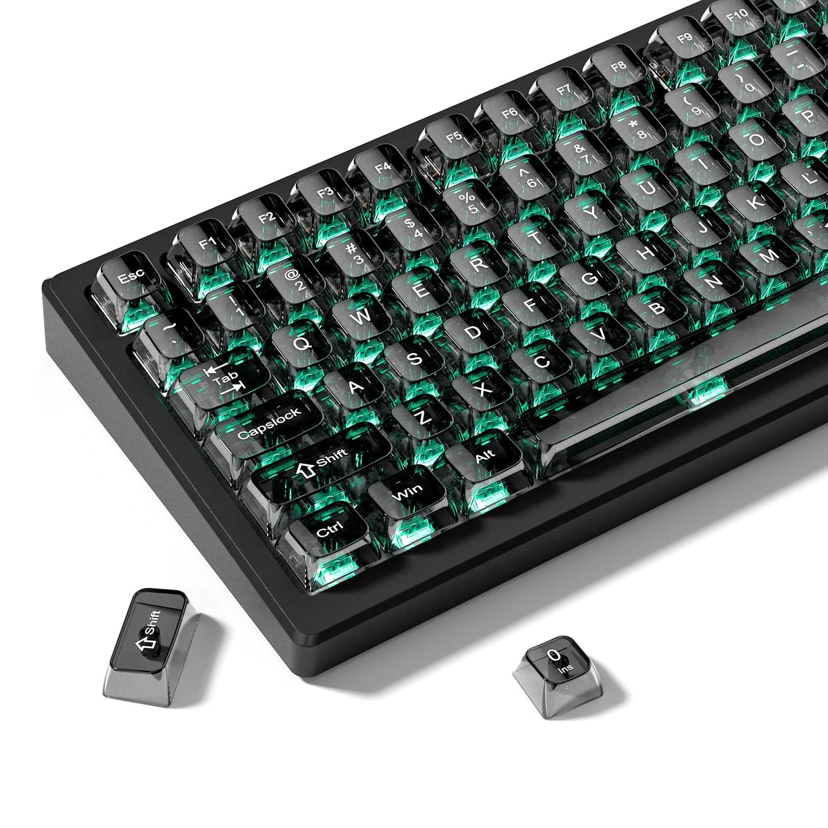 A close-up view of a black mechanical keyboard with crystal clear RGB keycaps and included switches.