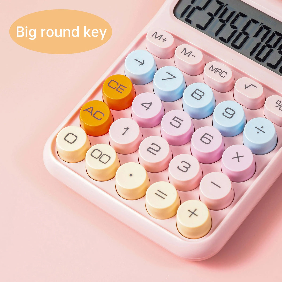 A pink mechanical 12-digit calculator showing various round number keys and a display.
